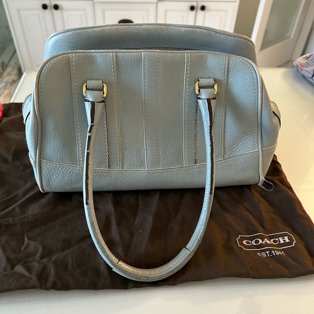 Vintage 2005 blue leather Coach purse
Damage in piping in one area see photo